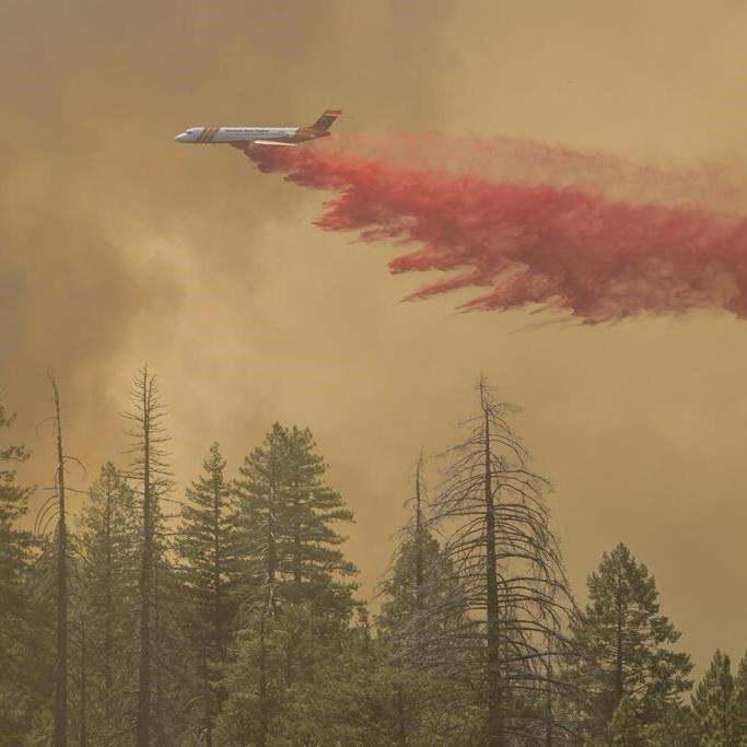 California man defends his home as wildfires push devastation and spread smoke across US West
